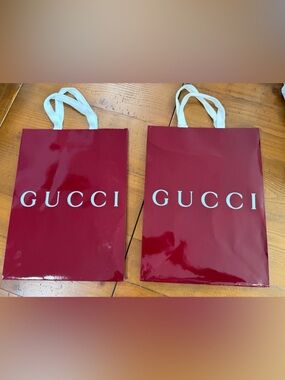 NWOT: Set of two Gucci Burgundy Glossy Paper shopping bags with White Logo